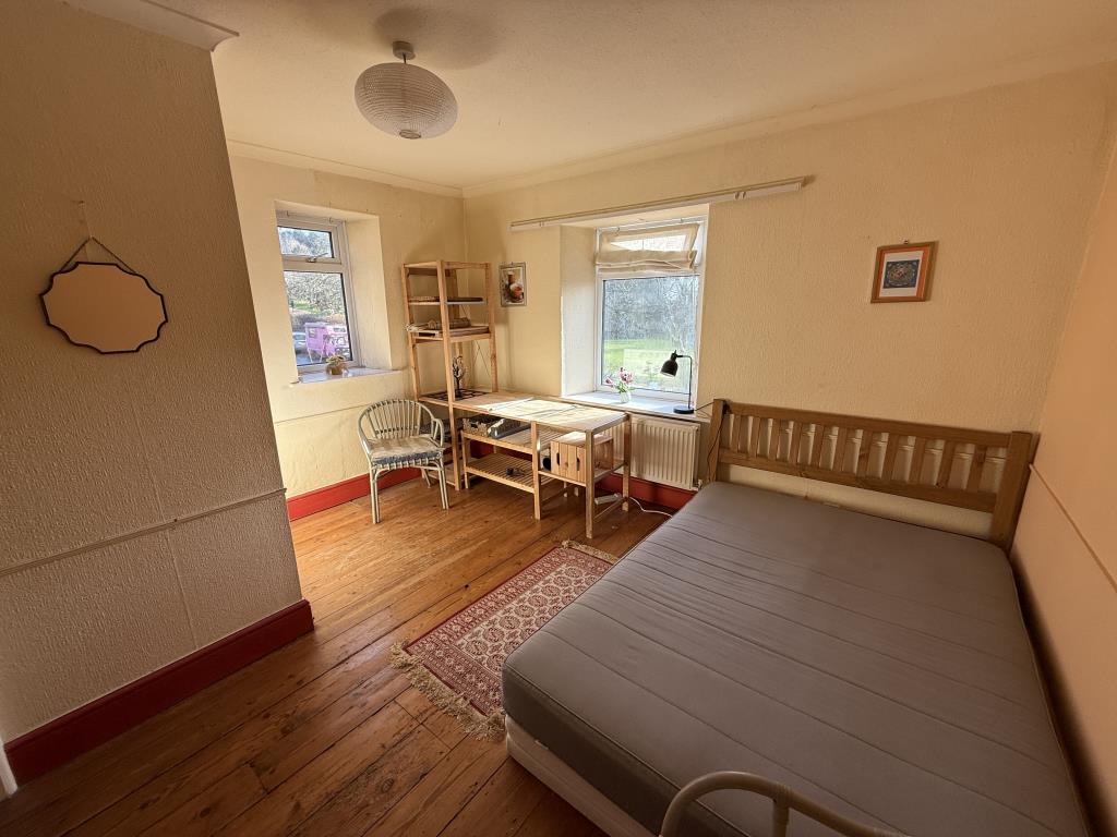 Lot: 125 - END-TERRACE TWO-BEDROOM HOUSE WITH REAR GARDEN FOR UPDATING - General view of bedroom one